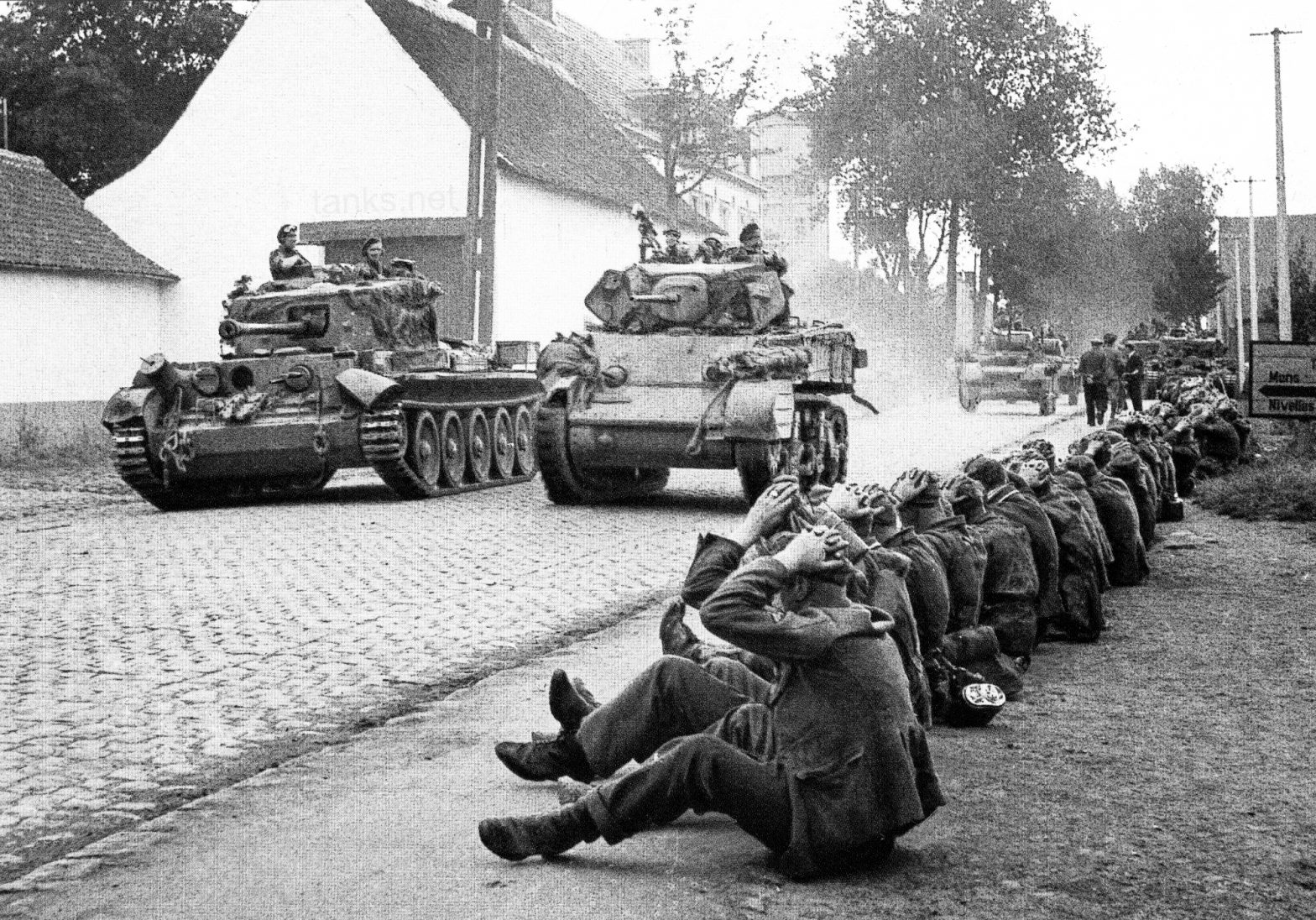 A27M Cruiser Tank Mark VIII Cromwell, seen here on the left rolling into Belgium past German prisoners of war