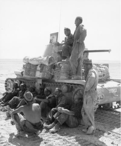 Italian soldiers on a Carro Armato M13/40 medium tank in North Africa in 1942. Source: German Federal Archive