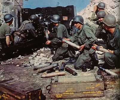 US soliders firing a 57mm Gun M1 at a German bunker in Bretagne in 1944