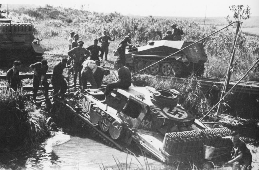 Panzer IV stuck in a stream in Russia, being recovered