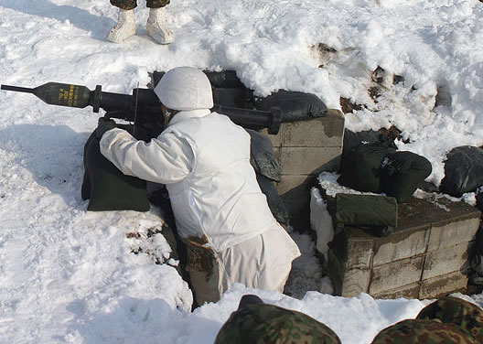 Japanese Ground Self Defense Force soldier using a Panzerfaust 3 during a training exercise