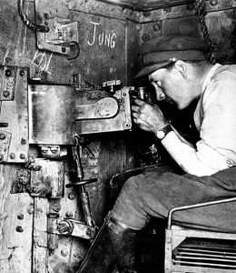 Machine gun position inside a captured German A7V heavy tank being tried out by a British officer