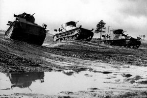 Two Vickers I medium tanks on the right and one Vickers II on the left